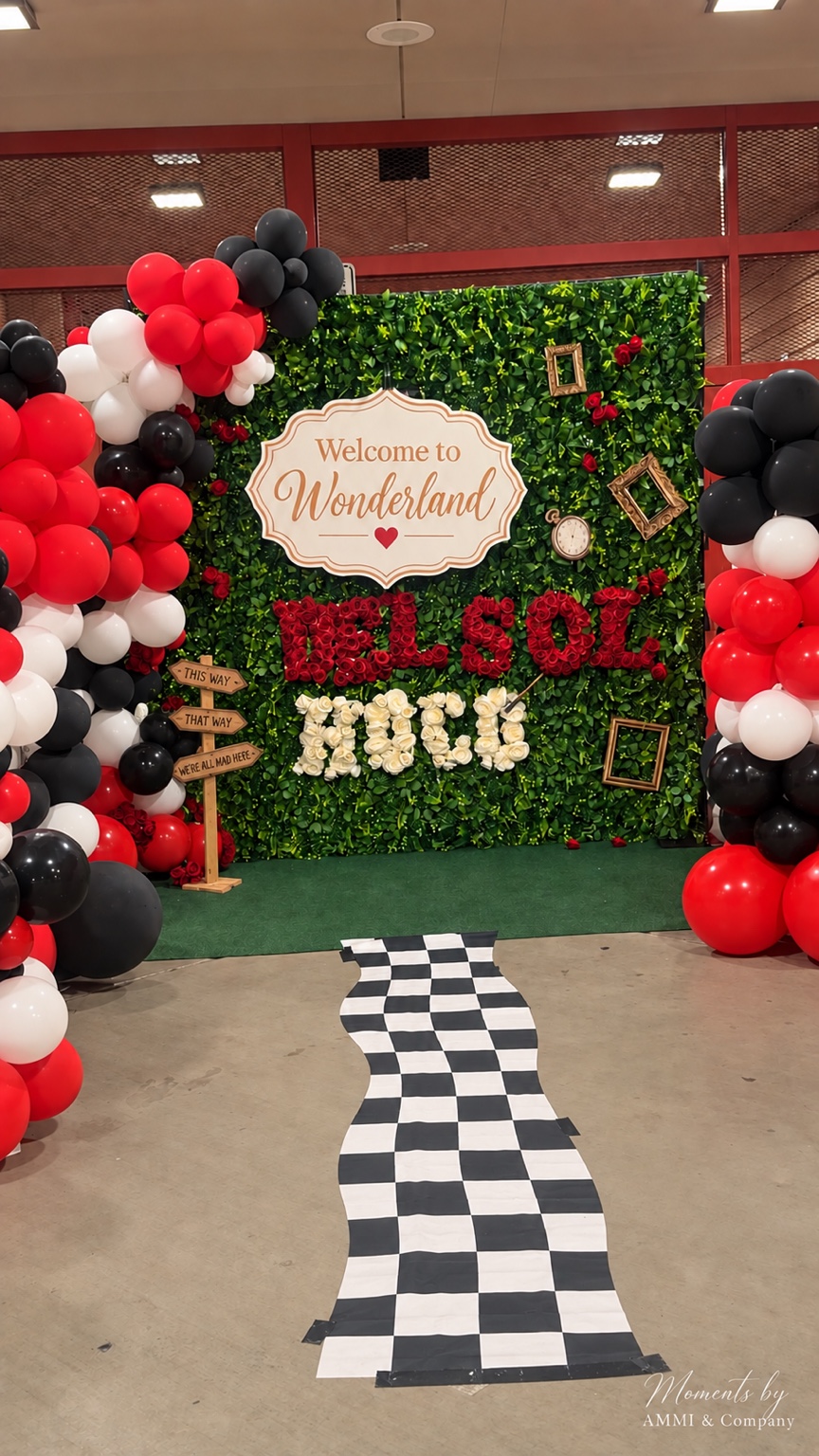 Wonderland homecoming greenery wall and balloons by Moments by AMMI & Company LLC